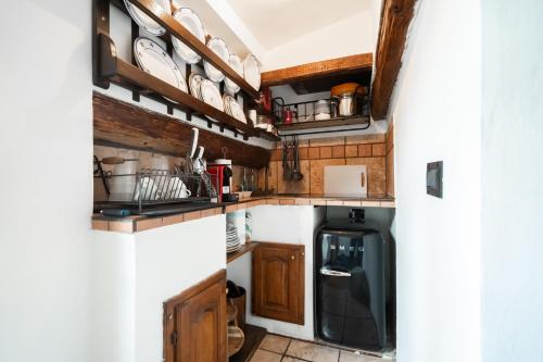 a small kitchen with a washer and dryer at TINA’S APARTMENT in Florence