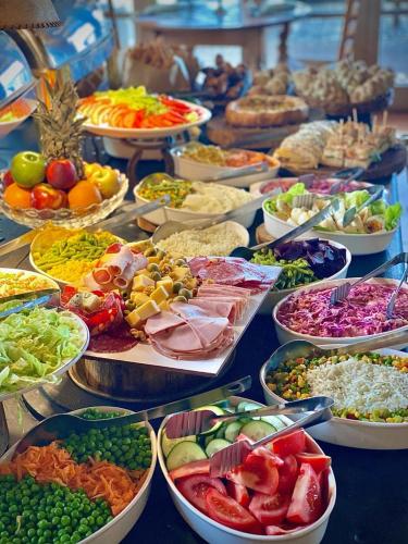a table filled with lots of different types of food at Estancia Turística San Pedro de Timote in Reboledo