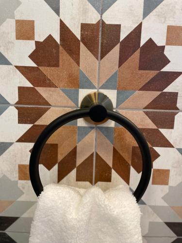 a white pillow hanging on a wall at Flora House Denver in Denver
