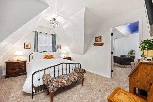 a bedroom with a bed and a chair at Flora House Denver in Denver