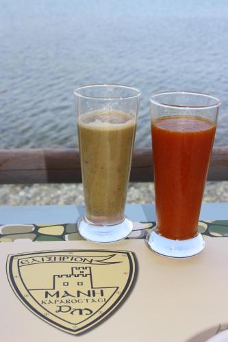 two drinks sitting on top of a table at Elixirion Guest House in Karavostasion