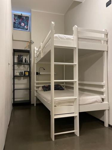 a couple of bunk beds in a room at Fra Storia e Modernità in Milan