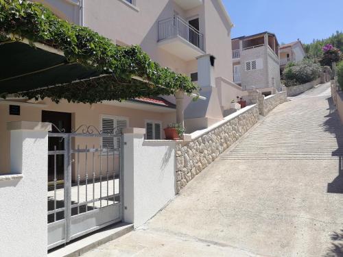 a street in a villa with a fence at Apartment D&D in Prigradica