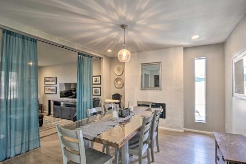 a dining room with a long table and chairs at 1 Mi to Dobson Ranch Modern Escape with Gazebo! in Mesa