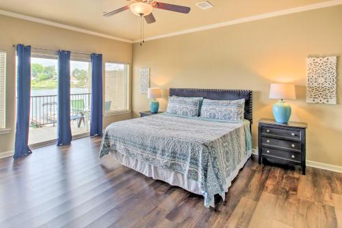 a bedroom with a bed and a ceiling fan at Balcony and Boat Slip Lakefront Unit in Hot Springs in Hot Springs