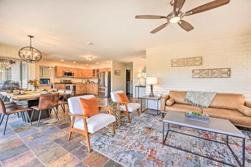 a living room with a couch and a table at Patio and Panoramic Desert Views Sedona Getaway! in Sedona