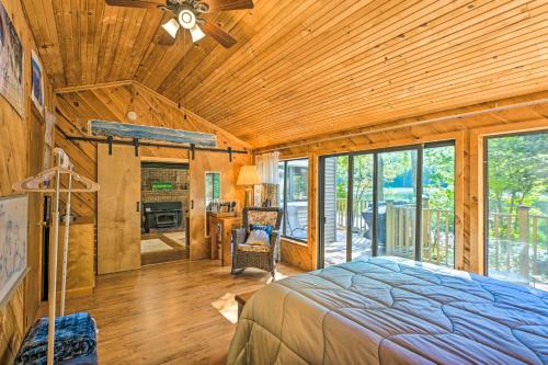 a bedroom with a bed and a wooden ceiling at Dreamy Bucksport Hideaway on Freshwater Pond! in Bucksport