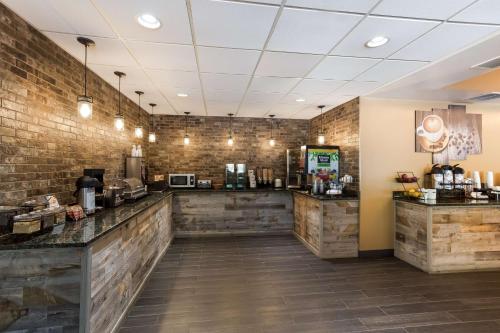 a fast food restaurant with wooden walls and a counter at Best Western Logan Inn in Chapmanville