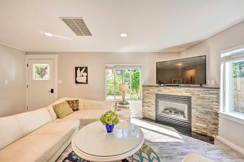a living room with a couch and a fireplace at Near I-405 and 1 Mi to Dtwn! Kirkland Family Home in Kirkland