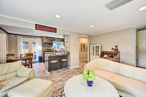 a living room with two couches and a kitchen at Near I-405 and 1 Mi to Dtwn! Kirkland Family Home in Kirkland