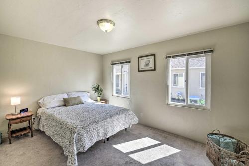 a bedroom with a bed and two windows at Bay Area Apt about 3 Mi to Downtown Mountain View in Mountain View