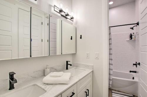 a white bathroom with a sink and a shower at Modern Mountain Escape Near Slopes, Lakes and Trails in Eden
