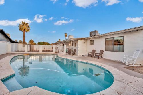 a swimming pool in the backyard of a house at Quiet Contemporary Executive 4BD, 3BA Estate with Pool in Tempe