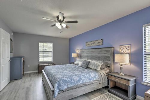 a bedroom with a bed and a ceiling fan at 7 Mi to World Equestrian Center Ocala Casa Azul in Ocala