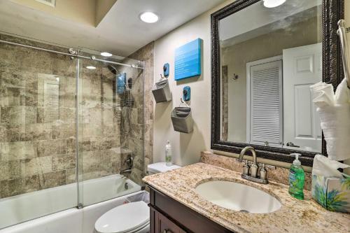 a bathroom with a sink and a toilet and a shower at Sea La Vie Sunny Indian Rocks Beach Condo! in Clearwater Beach