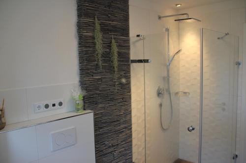 a bathroom with a shower and a walk in shower at Oktoberfest in Puchheim