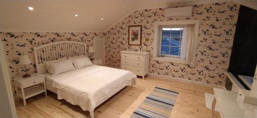a bedroom with a bed and a window at Villa Ladybug Unique design of your dreams in Foca