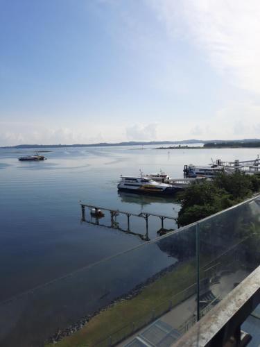 a view of a body of water with boats in it at One Residence Batam Unit 3AB in Batam Center