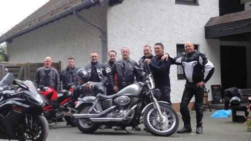 a group of men standing next to a motorcycle at Hotel Heiderhof in Obersteinebach
