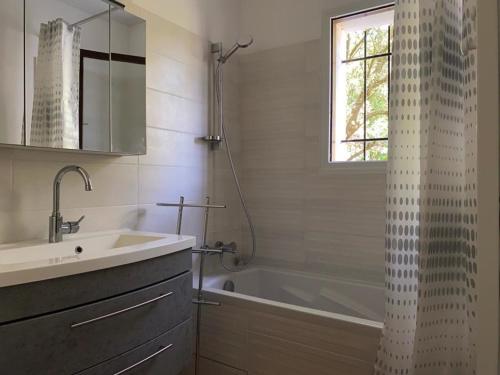 a bathroom with a shower and a sink and a tub at Maison vendéenne rénovée, accès direct plage, terrasses, BBQ, parking gratuit - FR-1-336-123 in Longeville-sur-Mer