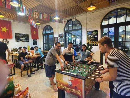a group of people playing a game of chess at AROMA Ha Long Hotel in Ha Long