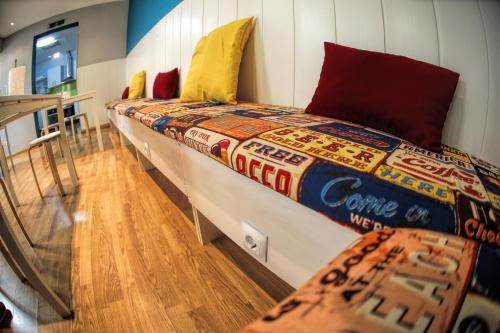 a large bed in the middle of a room at Onefam Sungate in Madrid