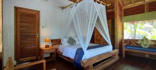 Postel nebo postele na pokoji v ubytování Amrita Maumere Resort