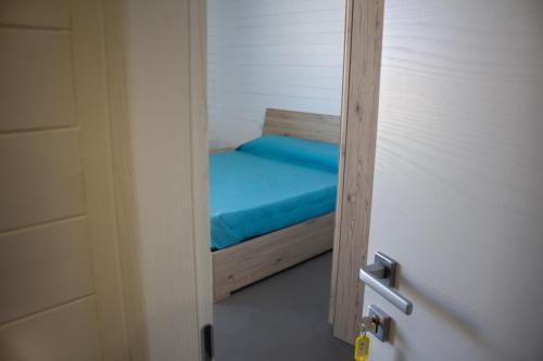 Postel nebo postele na pokoji v ubytování AURORA BEACH & SUITE