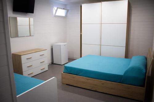 Postel nebo postele na pokoji v ubytování AURORA BEACH & SUITE