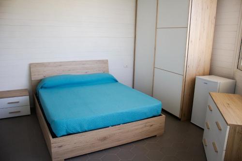 Postel nebo postele na pokoji v ubytování AURORA BEACH & SUITE