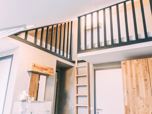 a loft conversion of a house with a staircase at Gut Hügle Jugendzimmer in Ravensburg