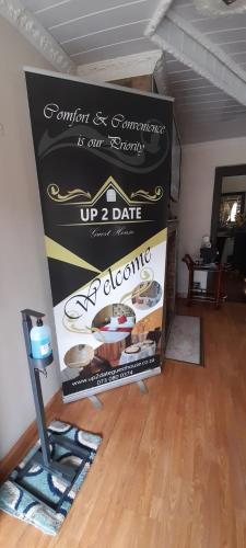TV a/nebo společenská místnost v ubytování UP 2 DATE GUESTHOUSE