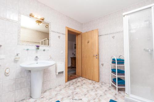 a bathroom with a sink and a shower at Haus Ruth in Obsteig