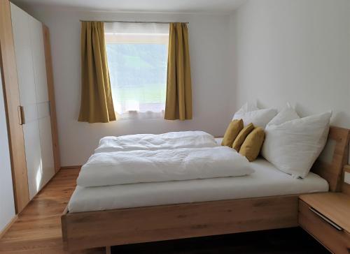 Postel nebo postele na pokoji v ubytování Appartement Heimatliebe