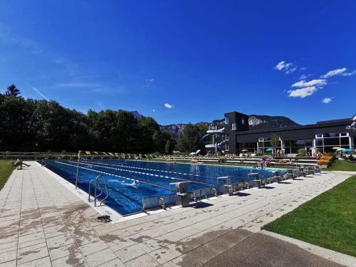 a large swimming pool in front of a building at Haus Waltl in Sankt Johann in Tirol