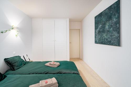 Ein Bett oder Betten in einem Zimmer der Unterkunft Duin én zeezicht te Zeedijk Oostduinkerke
