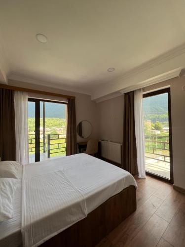 Postel nebo postele na pokoji v ubytování Lileo Inn Hotel