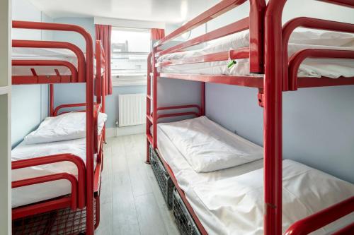 a group of bunk beds in a dorm room at Astor Victoria Hostel in London