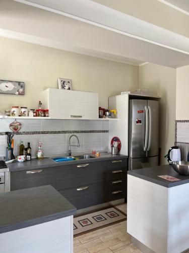 a kitchen with a black and white refrigerator at La casa di Silvia in Cantalupo in Sabina