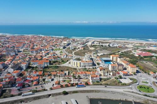 an aerial view of a city next to the ocean at Casa Chanel in Figueira da Foz