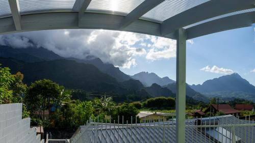 a view of the mountains from the balcony of a house at Appartement au cœur du village d'HellBourg in Salazie