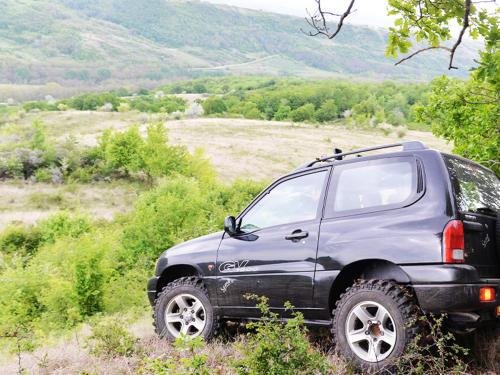 a black car parked on the side of a hill at Casa Pedro in Blăjani