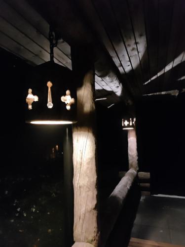 a dark room with a group of dolls and lights at Villa Lilja in Muurame
