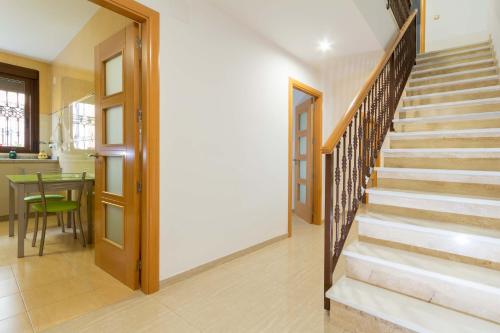 a hallway with stairs leading to a dining room at Villa Viana in Rute