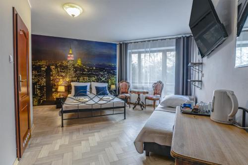 a living room with a view of a city at Royal Gdansk in Gdańsk