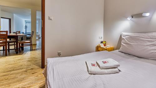 Posteľ alebo postele v izbe v ubytovaní Apartament Angelika B1 - 5D Apartamenty