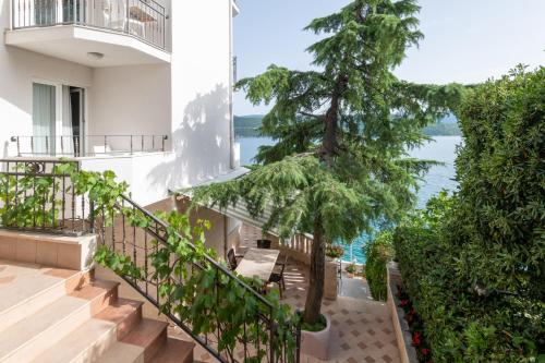 an apartment staircase with a view of the ocean at Hotel Villa Barbara in Neum