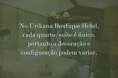 a bedroom with a sign that reads no unuvianania boutique hotelcada at Urikana Boutique Hotel in Teresópolis