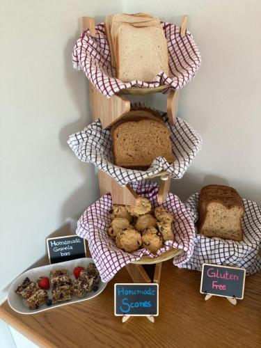 a shelf with a bunch of different types of bread at Seagull Cottage B&B in Portmagee