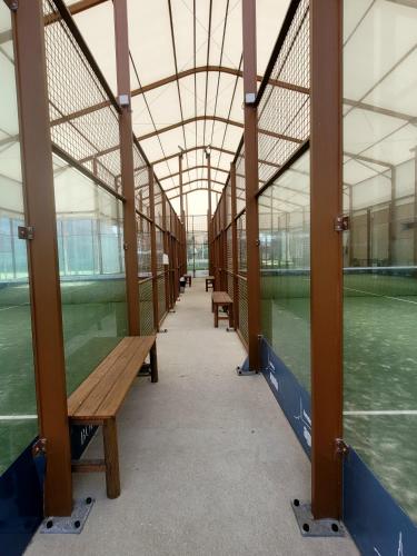 an empty hallway with benches in a building at Aguda Golf Vita Apartamento 2 Quartos in Arcozelo